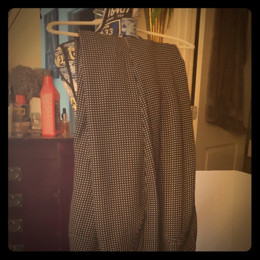 Black polka dot trousers.